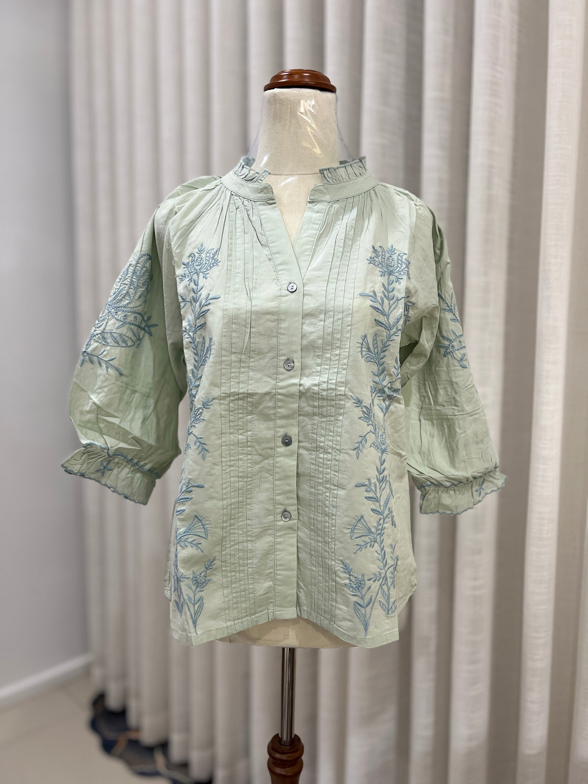 Lond sleeve green buttoned top